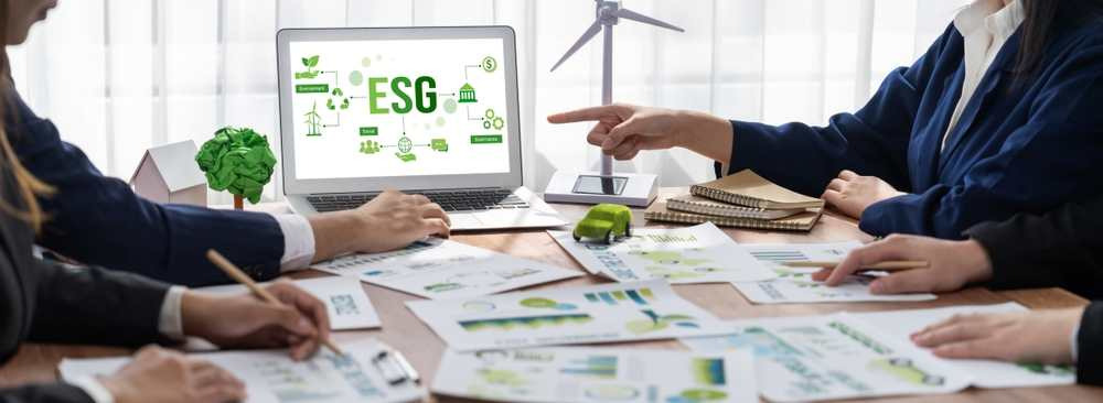 ESG environmental social governance display on laptop on eco-friendly company meeting with business people implementing environmental protection for clean and sustainable future ecology